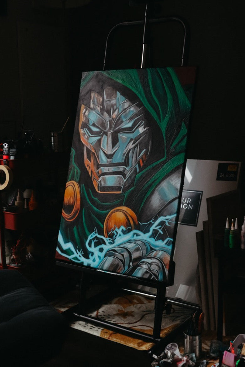A canvas painting of a sci-fi character with a metallic helmet, teal and green hood, and glowing blue energy effects, displayed on an easel in a dark studio or workshop.